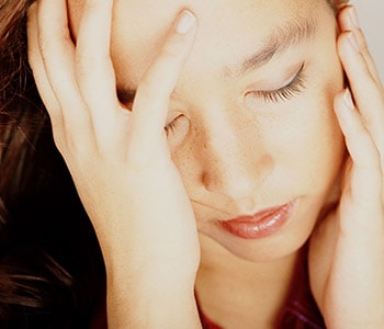 Woman with migraine