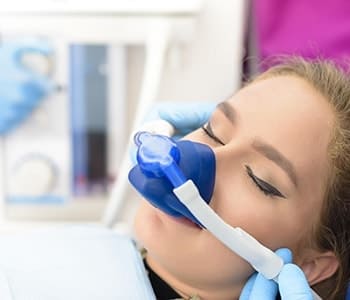 Young female patient being sedated