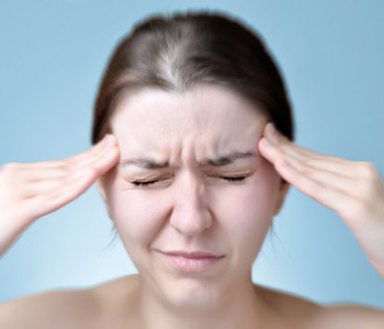 Woman with migraine