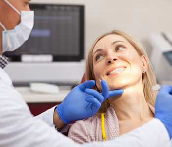 Woman getting her teeth examined