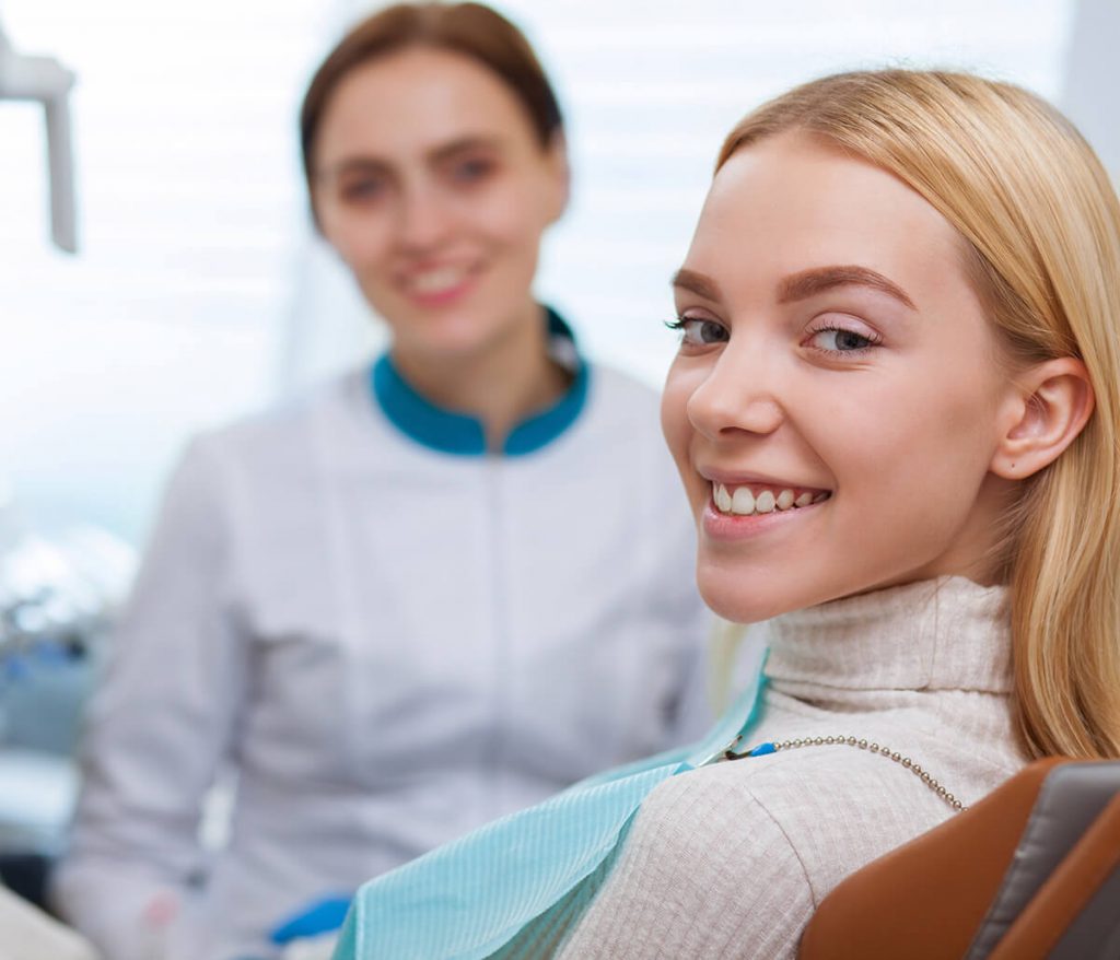 Happy young female patient