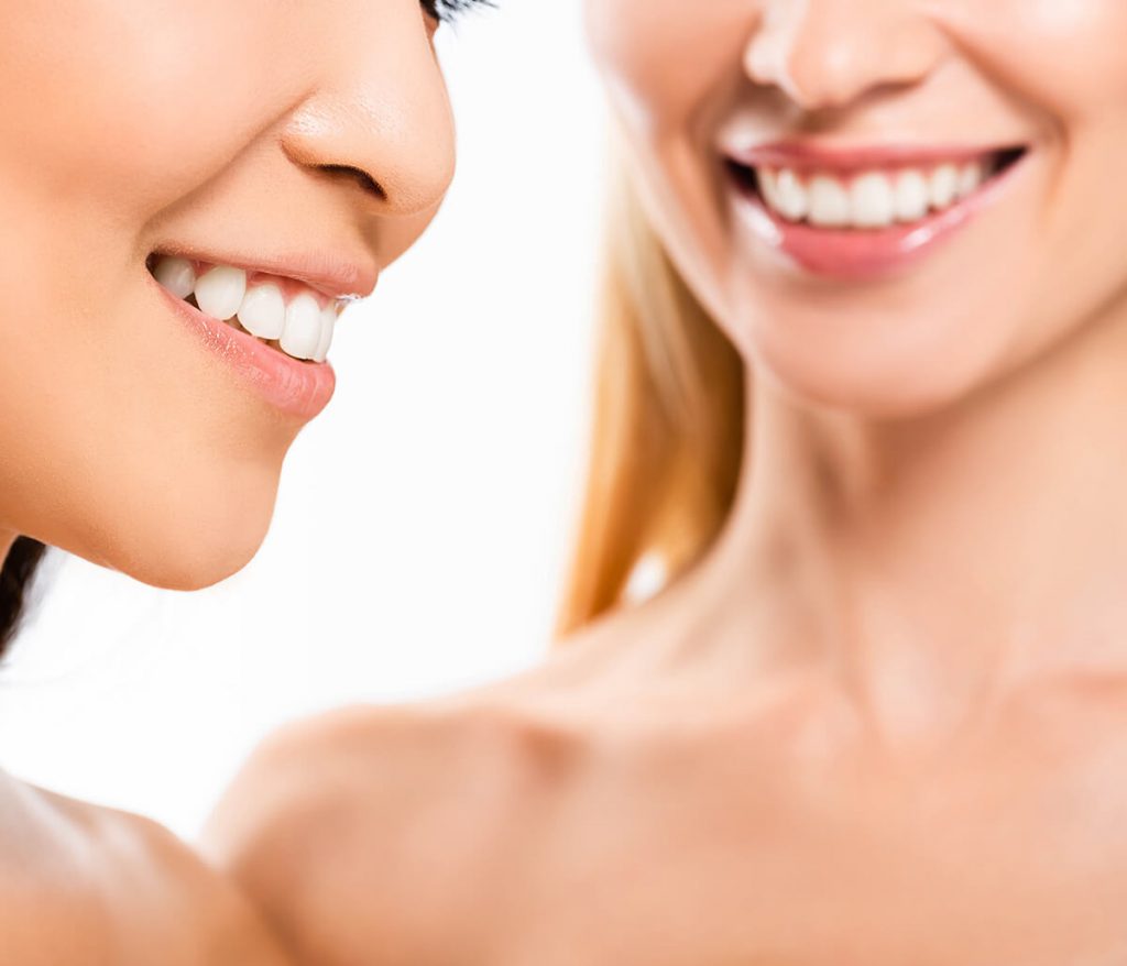 Two young women smiling