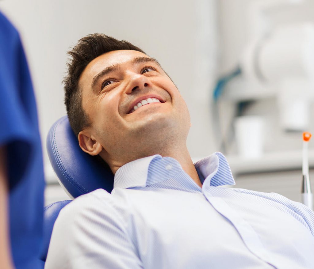 Middle-aged male patient smiling