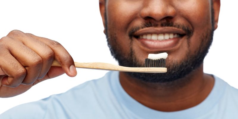 man brushing his teeth