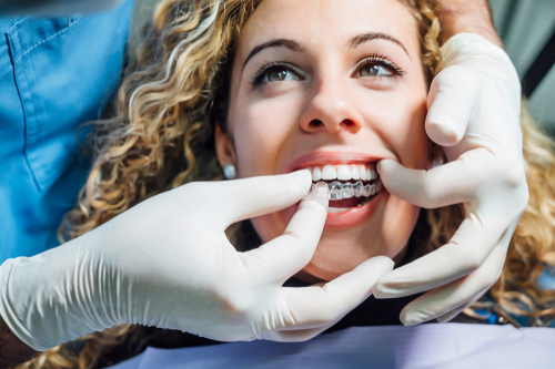 Woman at dentist getting invisalign 