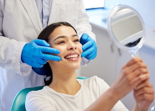 woman at the dentist after a procedure
