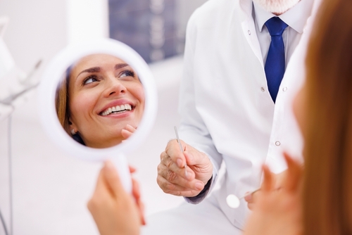woman admiring her smile