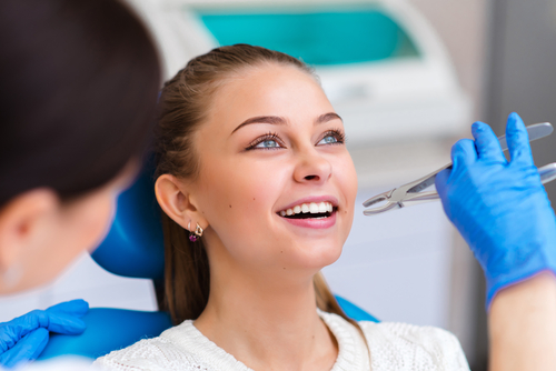 woman getting a tooth extracted